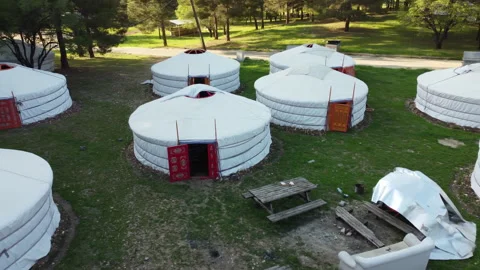 Mongolian tents standing side by side in the forest Stock Footage 258193569