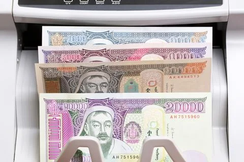 Mongolian tugrik in the counting machine Stock Photos