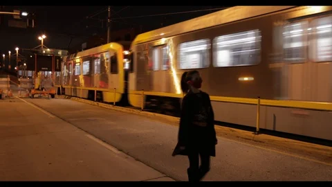 Monie love walking in front of Train. 스톡 동영상 127940333
