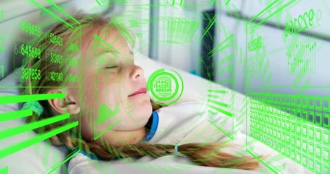Monitor activating green display around child head visualizing vital signs while Stock Footage 316087395