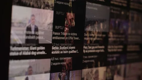Monitor with changing news feed and pictures close view Video stock 145490956