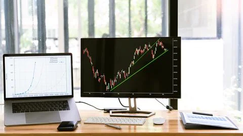 A monitor displaying the dynamic of real estate stock chart in the first qu.. Stock Photos