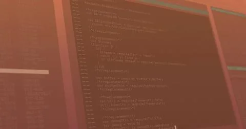 Monitor displaying JavaScript code lines at blurred office desk in warm reddish Stock Photos