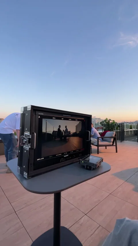 Monitor displays operator finetuning camera frame with precision Stock Footage 303060199