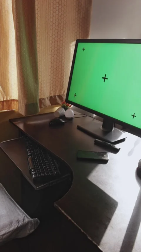 A monitor with a green screen and tracking points Stock Footage 314912824