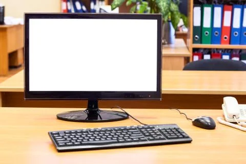 Monitor, keyboard, computer mouse on the office desk, workplace Stock Photos