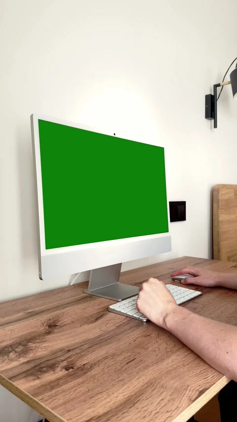 Monitor mockup display with green screen on studio desk. Creative worker ha.. Stock Footage 344050788