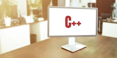Monitor in modern office with C plus plus text on the screen Stock Photos