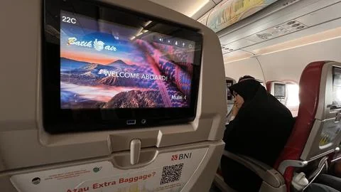 The monitor screen on board the Batik Air flight Jakarta Pekanbaru Stock Photos
