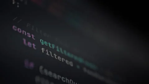 On a monitor screen a dynamic stream of numbers and symbols rapidly updates 動画素材 331475017