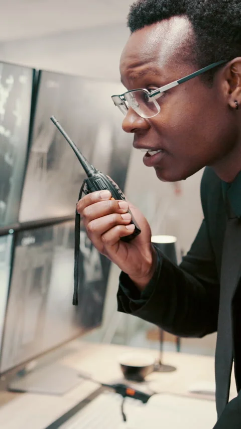 Monitor, security guard and black man with radio in control room, cctv Stock Footage 335291619
