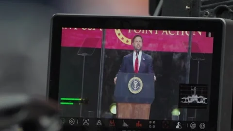 A monitor shows the stage feed at the Charlie Kirk memorial service Stock Footage 345298480