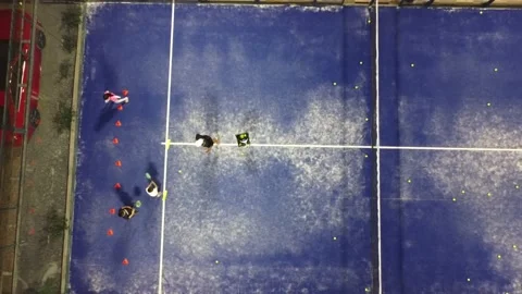 Monitor teaching padel class to childs, his students paddle, tennis Stock Footage 233297162