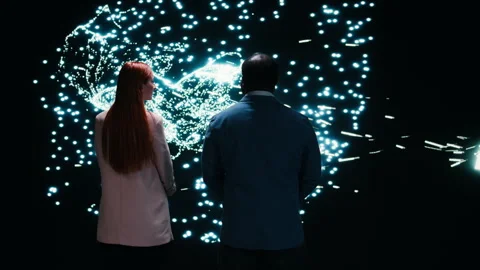 Monitoring AI model, AR projection and engineering team collaborating Stock Footage 330209705
