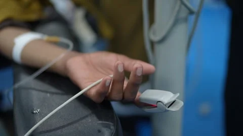 Monitoring arterial oxygen saturation (SpO2) levels in a Pakistani clinical Stock Footage 327635304
