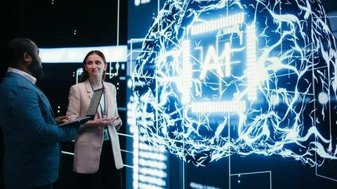Monitoring artificial intelligence, laptop and team of engineers 写真素材