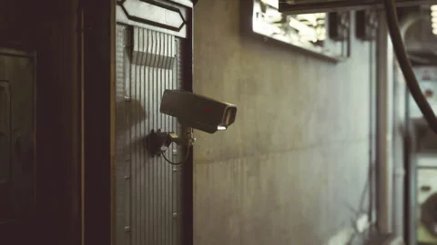 Monitoring device highlights textured door under industrial lighting Stock Footage 342433122