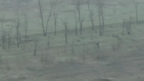 Monitoring Enemy Personnel Movement in Misty Rural Terrain Stockbeeldmateriaal 332354810