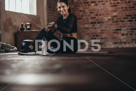 Monitoring her fitness performance on smartwatch Stock Photos