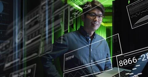 Monitoring IT engineer wearing dark shirt and glasses in data center racks, with 库存照片