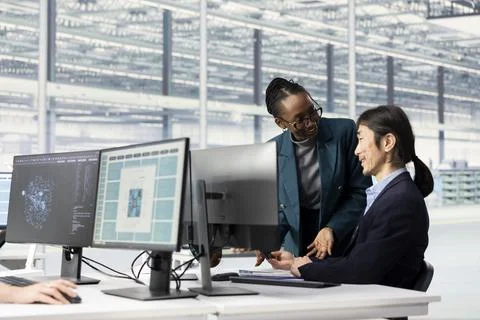 Monitoring microchip production, neural network and multiracial engineering team 스톡 사진