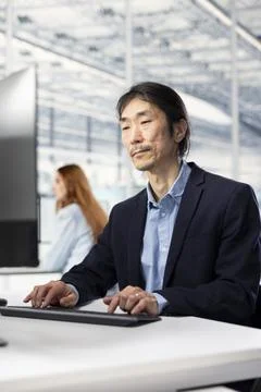 Monitoring microchip production, research facility and senior engineer Stock Photos