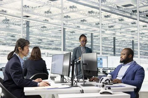 Monitoring microchip production volumes, performance metrics and engineers Stock Photos