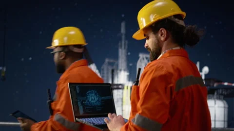 Monitoring operations with AI, oil crisis and offshore platform engineering team Stock Footage 336201218