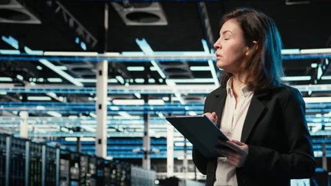 Monitoring systems, tablet and programmer in data center Stock-Footage 329331130