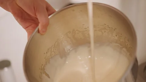 Monitoring texture and consistency meticulously during preparation. Adjusting Stock Footage 347327564