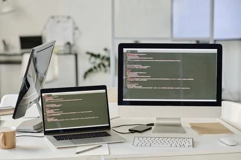 Monitors with codes ar office Stock Photos