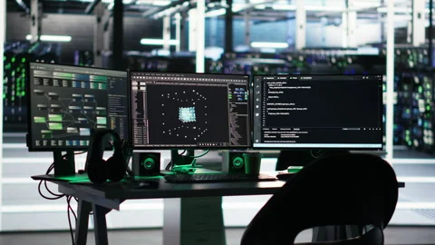 Monitors in data center displaying node tree programming software Stock Footage 307034009