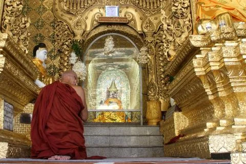 Monk and buddha Stock Photos