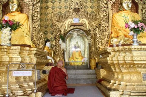 Monk and buddha Stock Photos
