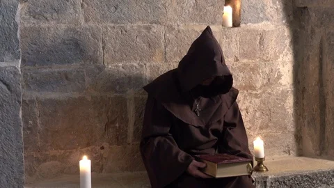 Monk with the bible Video stock 97474316