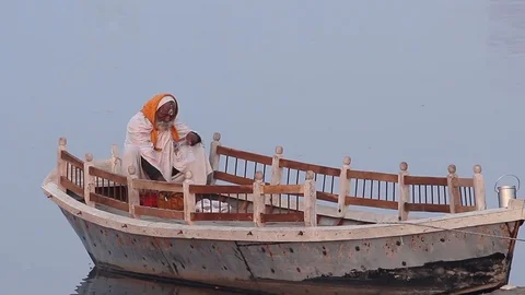 Monk on boat Stock Footage 125326936