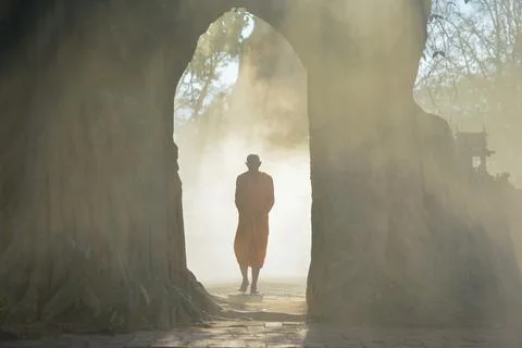 Monk Buddhist on during mist sunrise at temple, Thailand,vintage style Stock Photos