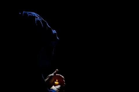 Monk with candle. Stock Photos
