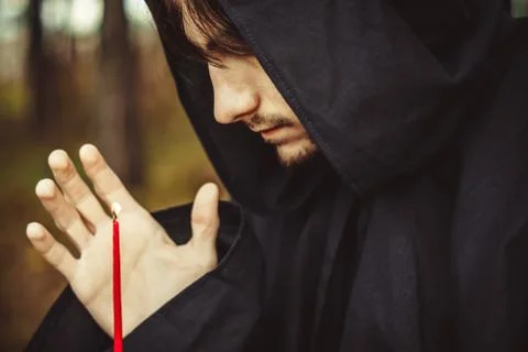 A monk with a candle Stock Photos