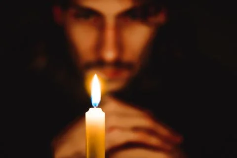 A monk with a candle Stock Photos