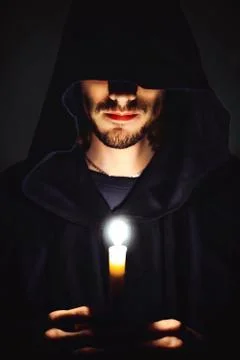 A monk with a candle Stock Photos