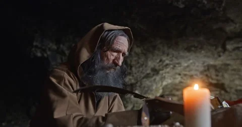 Monk chronicler writes an ancient manuscript Video stock 171477638