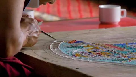 Monk creating sand mandala Stock Footage 128200946