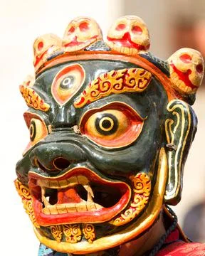 Monk in dharmapala mask performs a religious Cham Dance of Tibetan Buddhism 写真素材