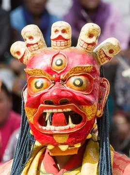Monk in dharmapala mask performs a religious Cham Dance of Tibetan Buddhism 写真素材