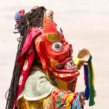 Monk in dharmapala mask performs a religious Cham Dance of Tibetan Buddhism 写真素材