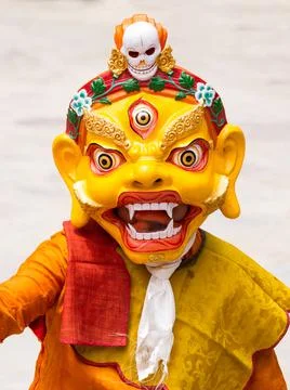Monk in dharmapala mask performs a religious Cham Dance of Tibetan Buddhism Stock Photos