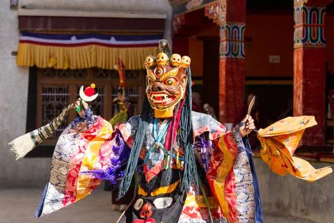 Monk in dharmapala mask performs a religious Cham Dance of Tibetan Buddhism 스톡 사진
