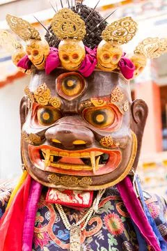 Monk in dharmapala mask performs a religious Cham Dance of Tibetan Buddhism 스톡 사진