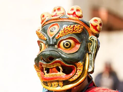 Monk in dharmapala mask performs a religious Cham Dance of Tibetan Buddhism Stock Photos